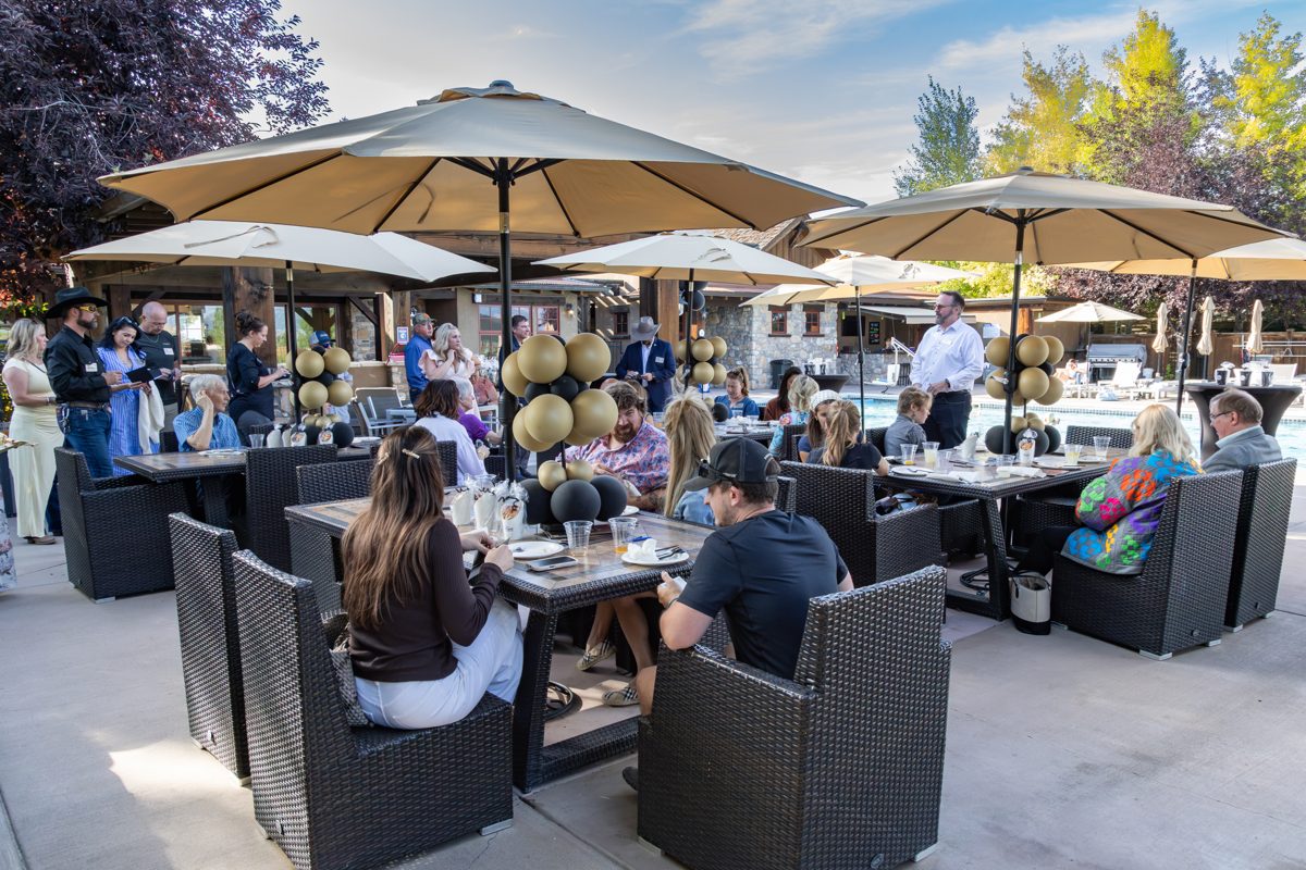 Alliance members on the patio at the Faces of Bozeman Alliance summer social at the Black Bull
