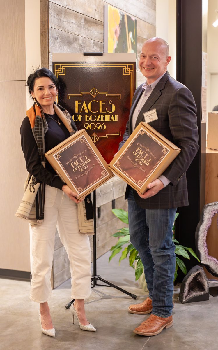 Members holding their books at the 2026 Faces of Bozeman launch party