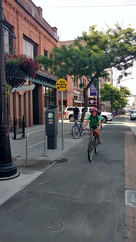 Emily Olson rides in a bike-only lane on Higgins Avenue in Missoula
