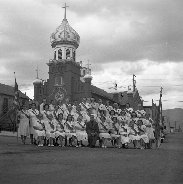 Fr. Nikolaj Dazgich with the Circle of Serbian Sisters Drill Team, 1940  Photo courtesy Butte-Silver Bow Public Archives, 75.090.01