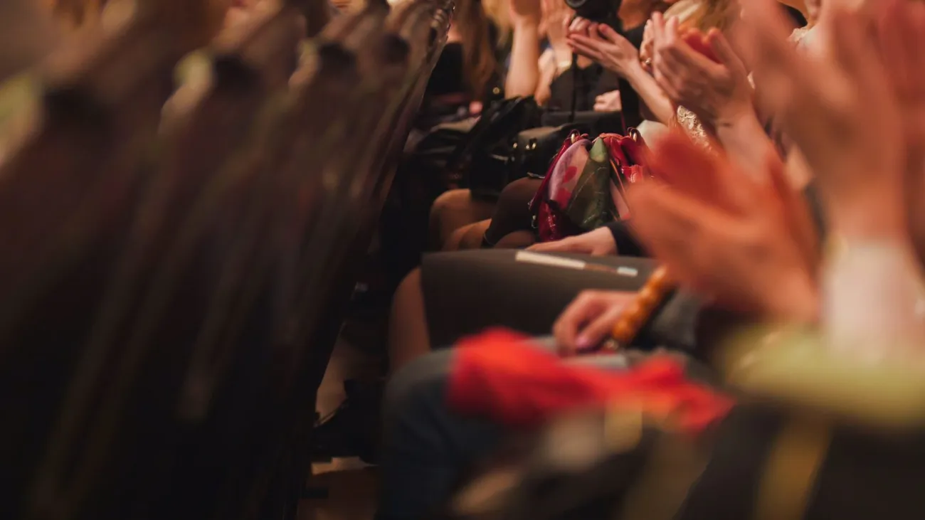 Theater audience applauding a performance