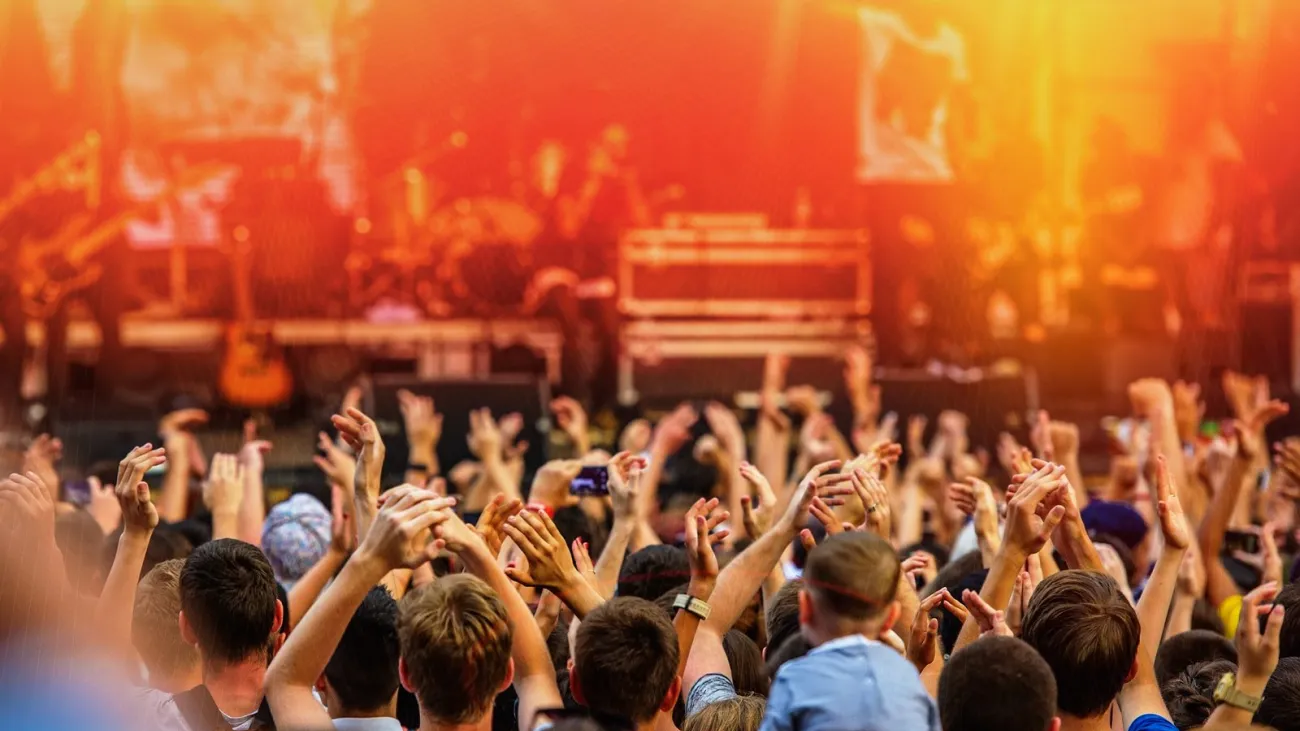 Rock band playing to fans at a concert