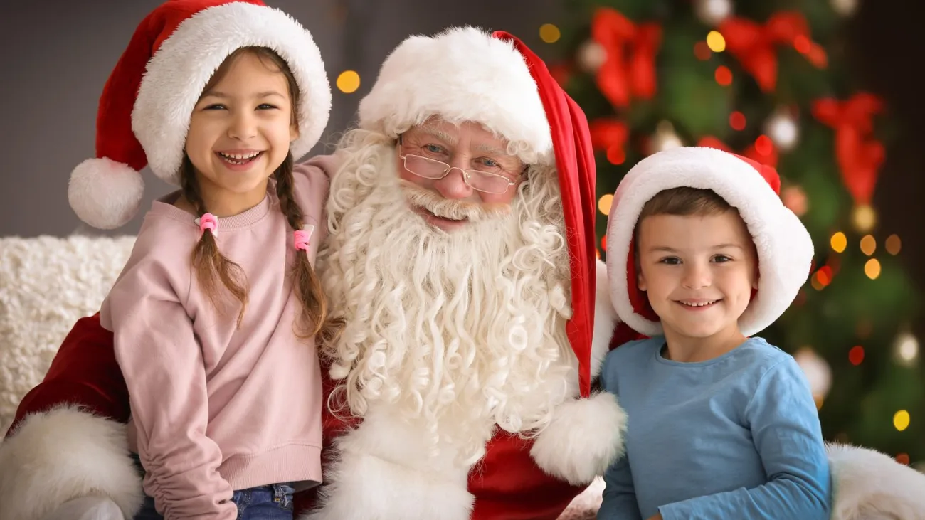 Children sitting on Santa Claus's knees