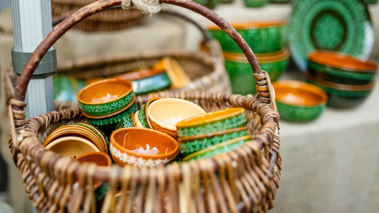 Handmade ceramic cups and bowls for sale at a craft fair