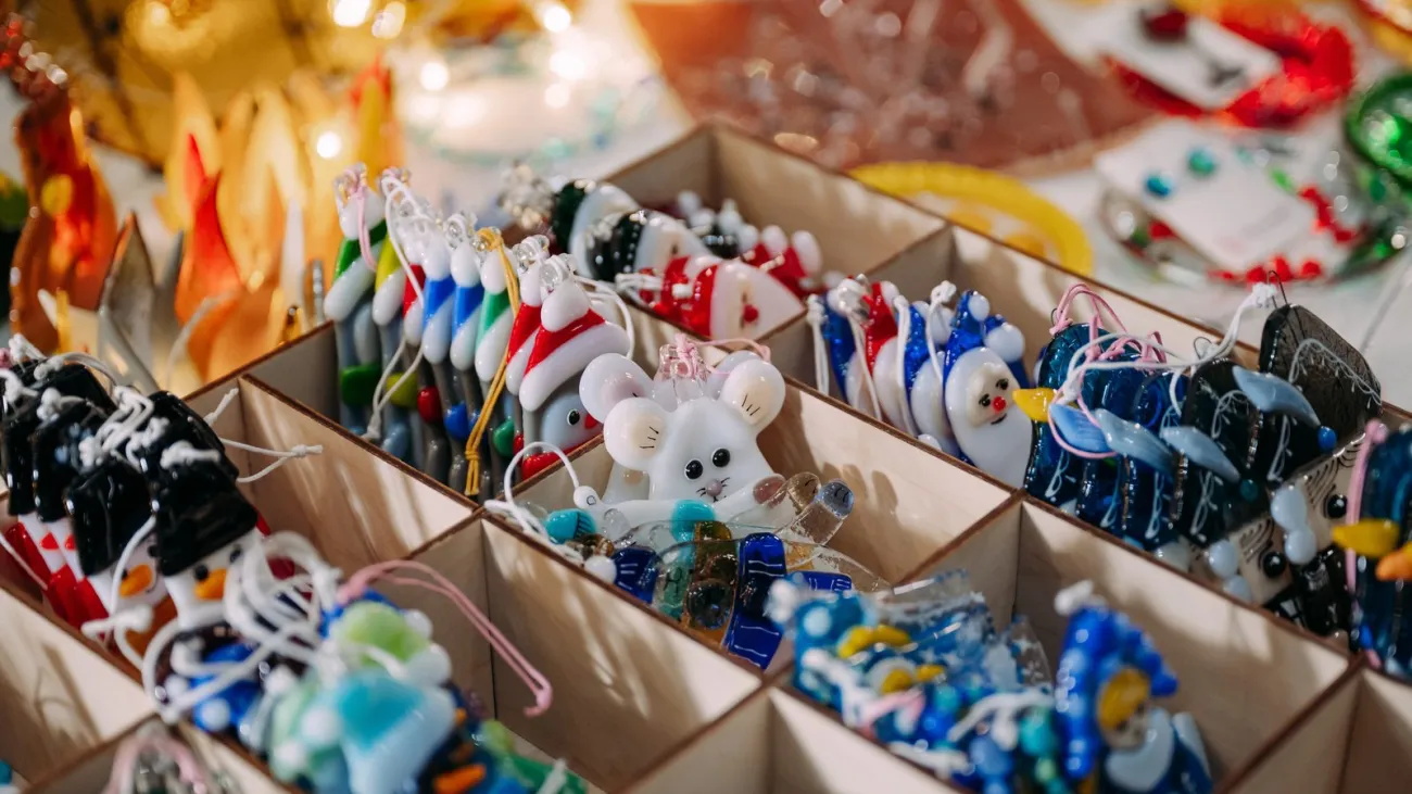 Christmas ornaments on display at a holiday market