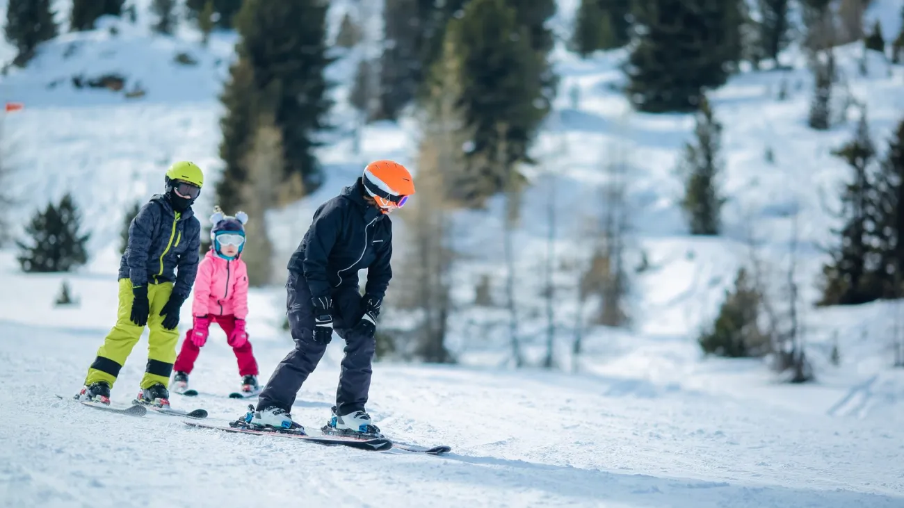 Group of children learning to ski