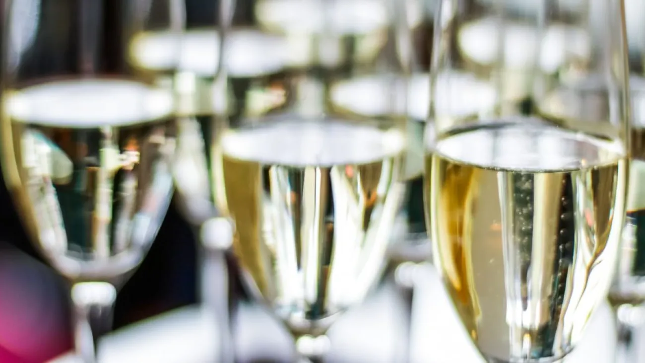 Glasses of sparkling wine served at a charity dinner