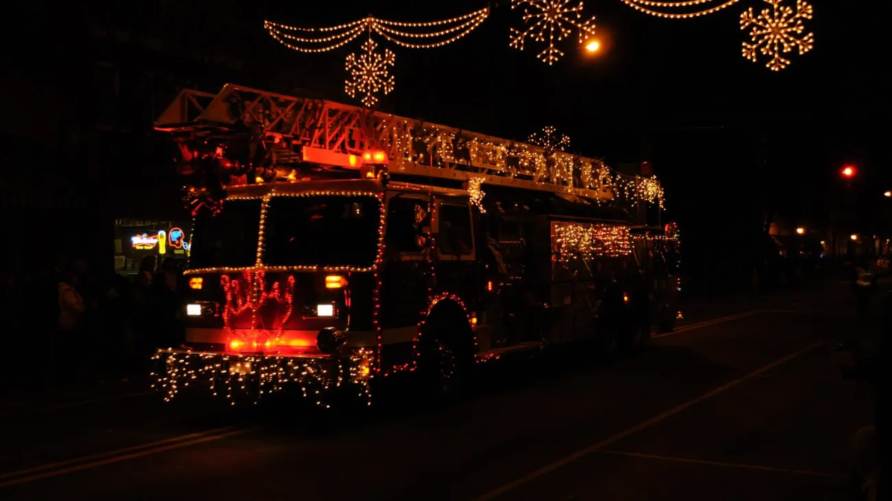 Lighted float in a Christmas parade at night