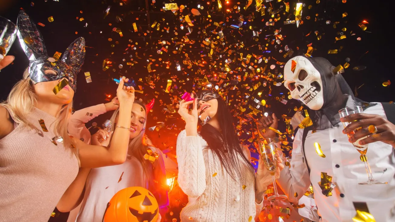 People in costumes dancing at a Halloween party