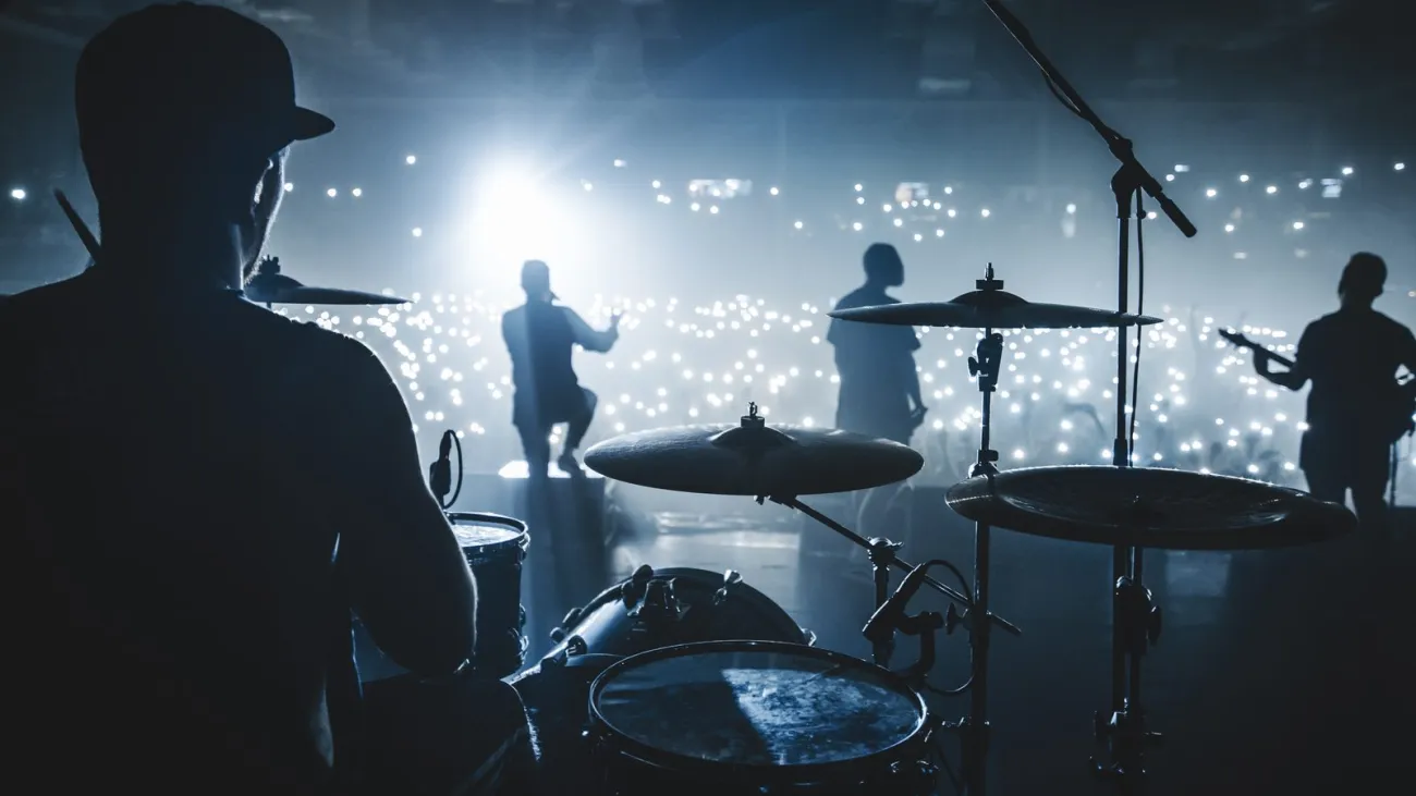 Silhouette of a band performing on a concert stage