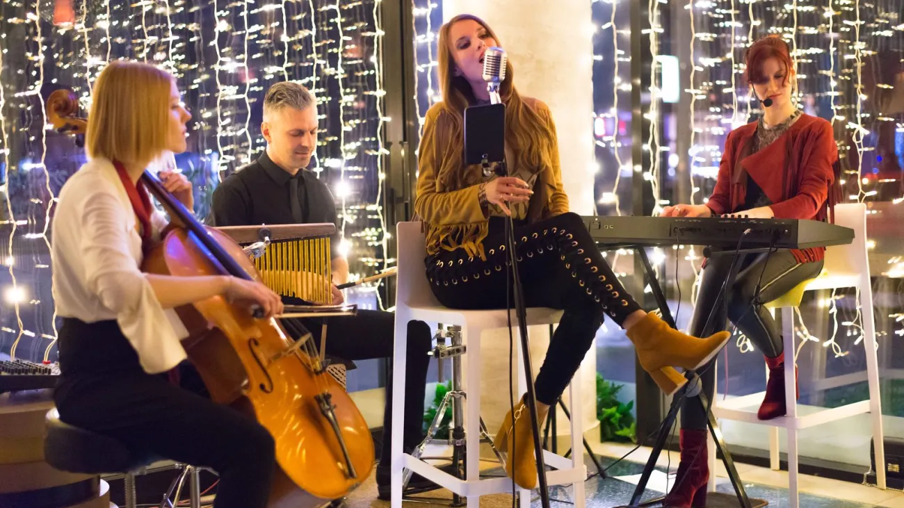 Band playing on a small stage at night