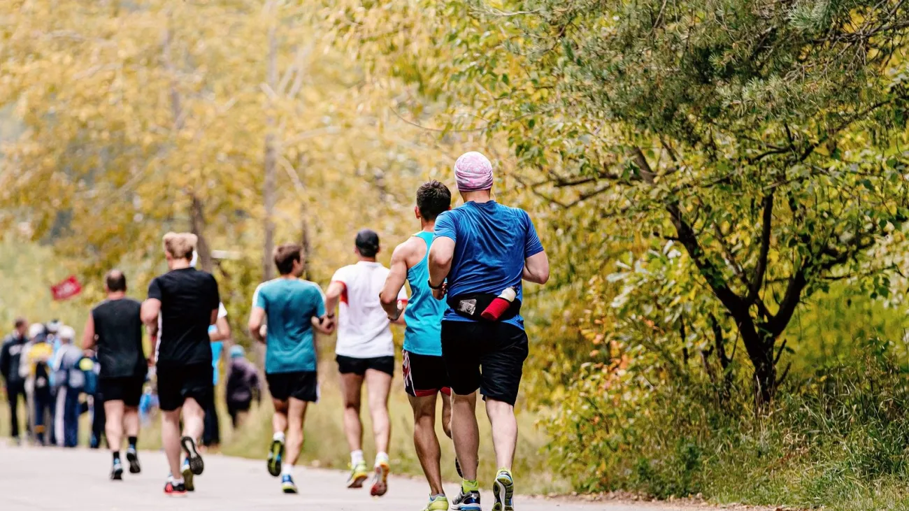 Group of runners in an autumn park