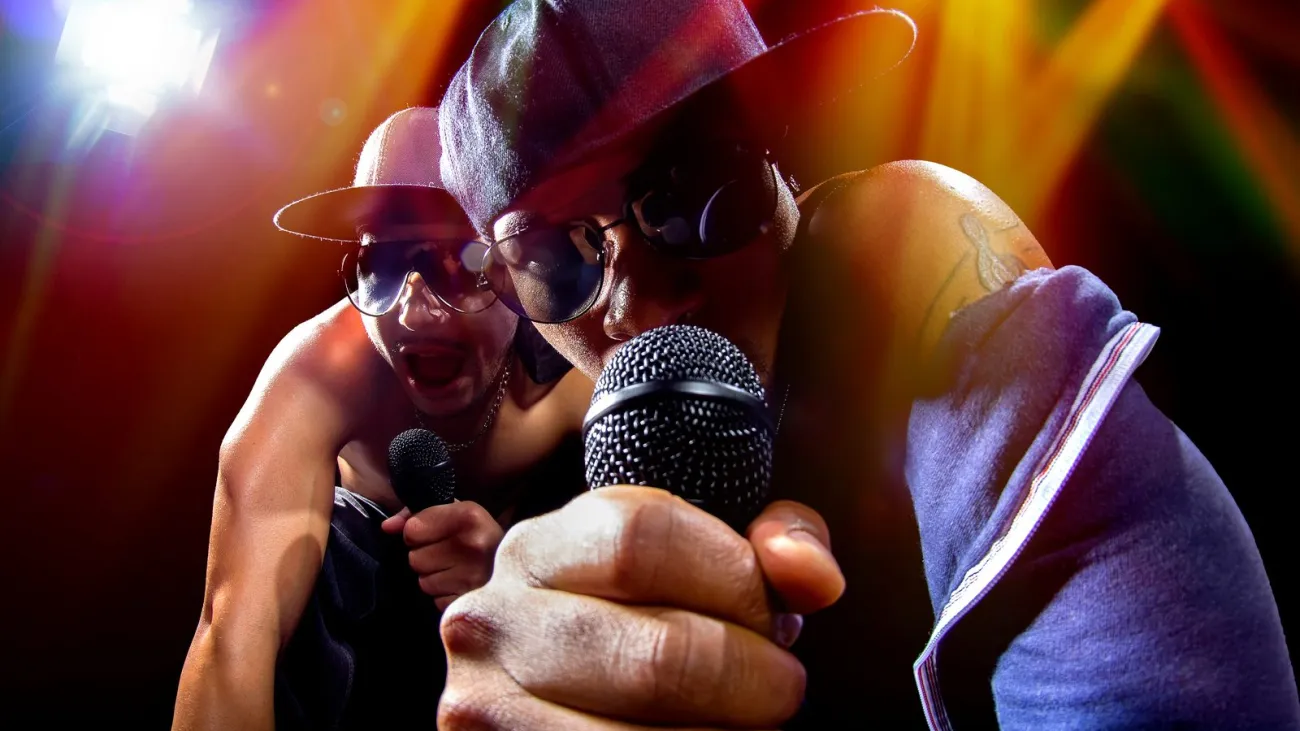Rappers performing a hip hop concert with microphones