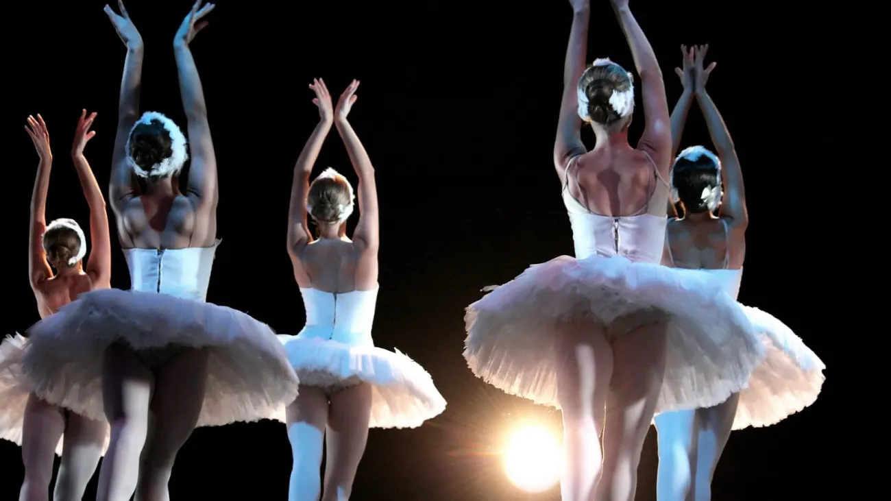Ballet dancers on stage performing Swan Lake