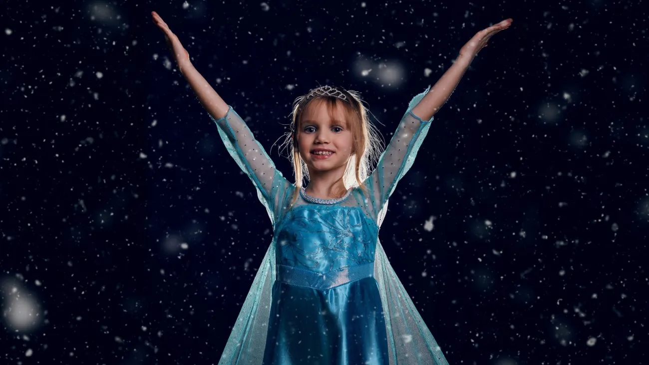 Girl in a blue snow princess costume