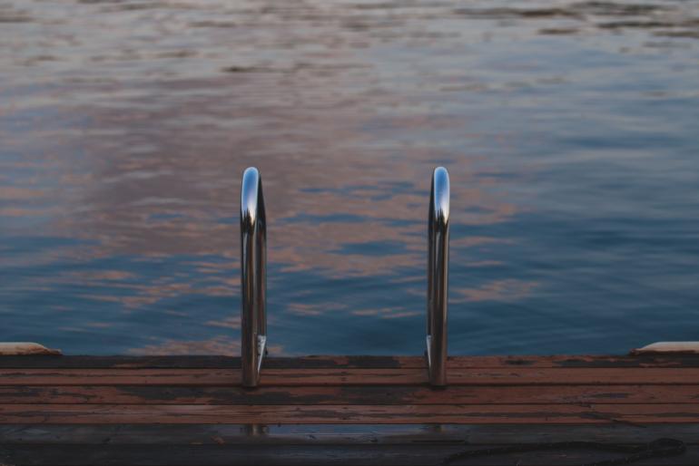 swimming handrails on dock at lake