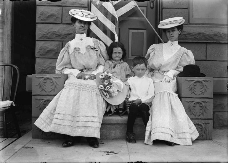 Portrait of two women with children