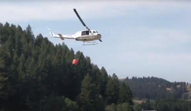 Helicopter approaching to fill bucket