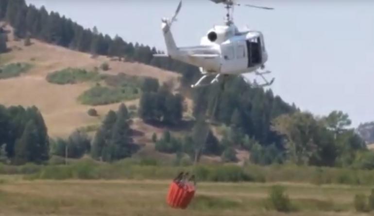Helicopter with fire bucket