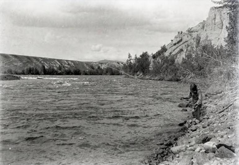 Native man fishing in the Pend d' Oreille River