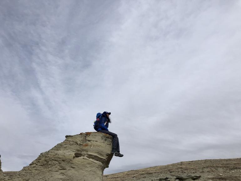 Lailani Upham perched on rocky outcropping photo