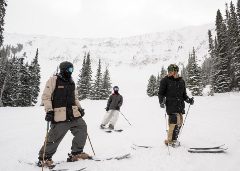 A group of friends meet below a run down one of Big Sky’s seemingly unlimited skiable terrain. 