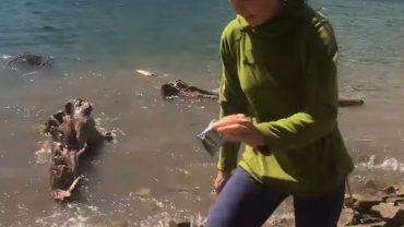 Woman trying to dodge tidal wave at Lake Leigh