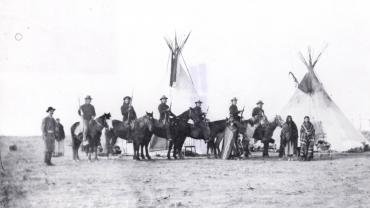 Six Crow Scouts outside Fort Custer