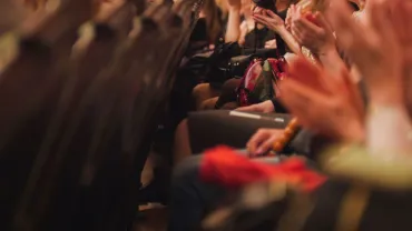 Theater audience applauding a performance
