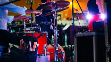 Drummer playing drums at a live concert