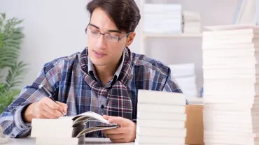 Writer presenting his books to an audience