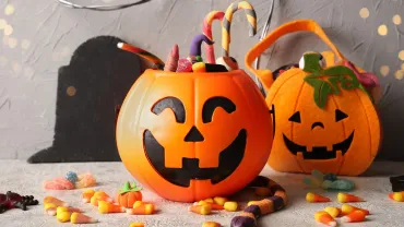 Jack-o-lantern bucket filled with Halloween candy