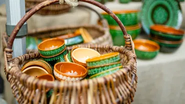 Handmade ceramic cups and bowls for sale at a craft fair