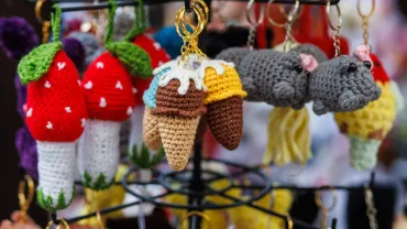 Handmade crochet keychains at a holiday craft stall