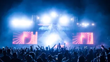 Crowd dancing at an electronic music show