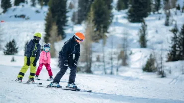 Group of children learning to ski