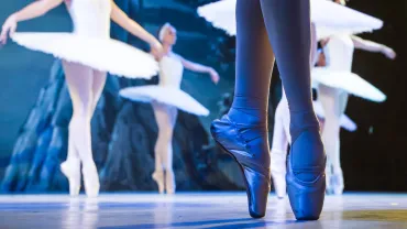 Legs of ballerinas dancing in Swan Lake