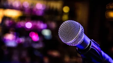 Comedy performance with a microphone in a bar