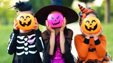 Children in Halloween costumes having fun