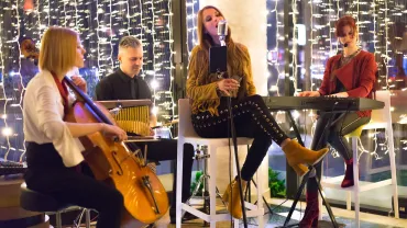 Band playing on a small stage at night
