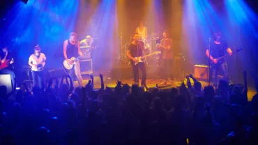 Band playing a song for a live audience