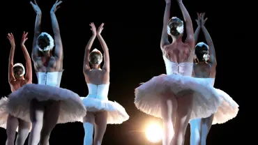 Ballet dancers on stage performing Swan Lake