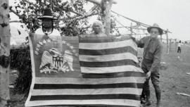 Two Chippewa-Cree Men Posing with 1803 Peace Flag