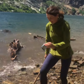 Woman trying to dodge tidal wave at Lake Leigh