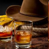 Still-life of cowboy hat with booze