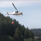 Helicopter approaching to fill bucket