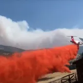 Plane dropping retardant on Middle Creed Fire
