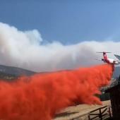 Plane dropping retardant on Middle Creed Fire