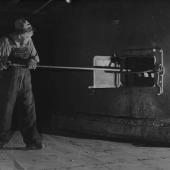 Man cleaning zinc furnace in Great Falls