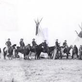 Six Crow Scouts outside Fort Custer